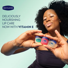 A model holds three small Vaseline Lip Therapy minis in different colors beneath text