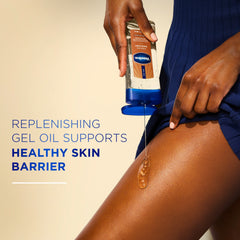 A person pours Vaseline Cocoa Radiant gel oil onto the thigh