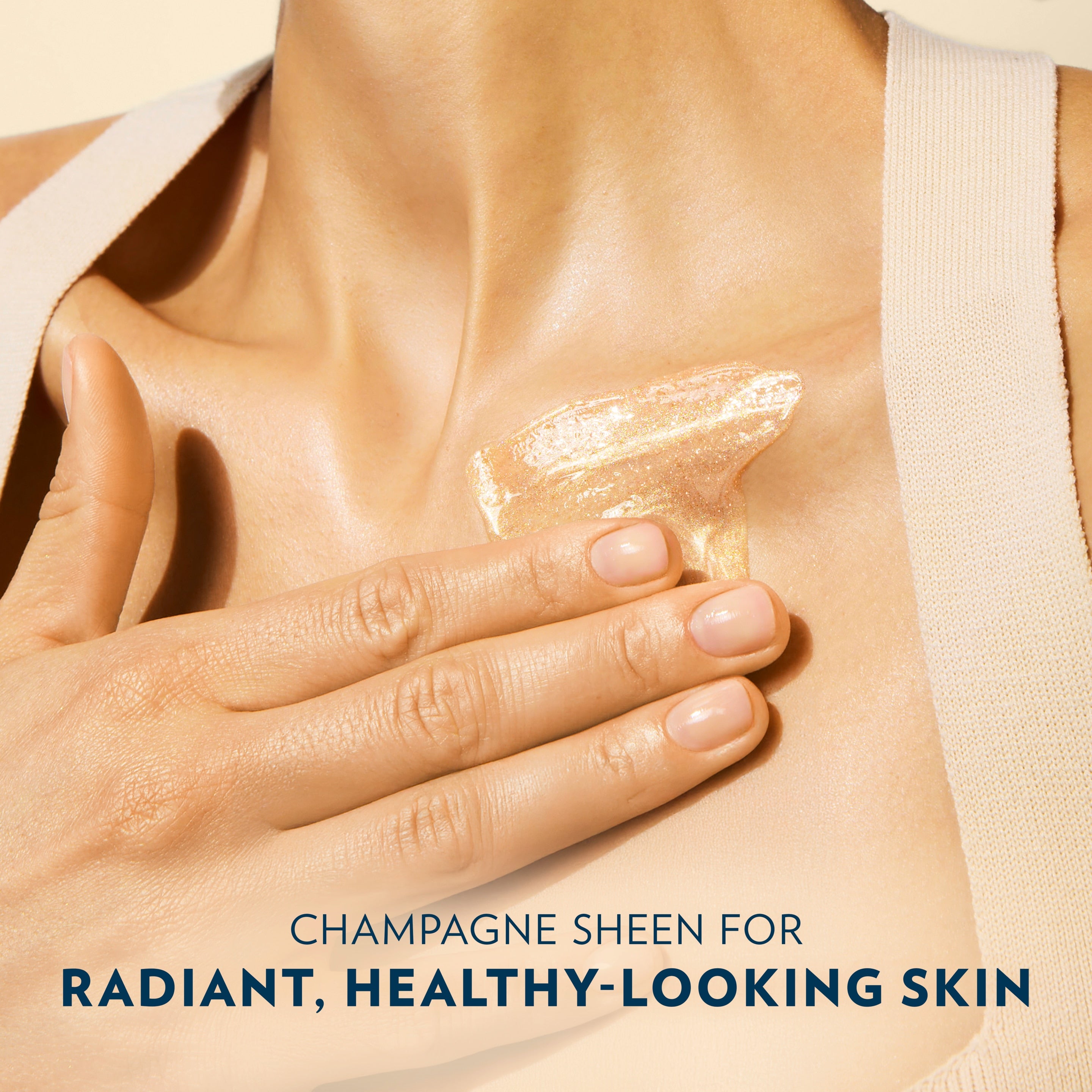 A hand spreads Vaseline Sunlit Glow Gel Oil across the upper chest area above text