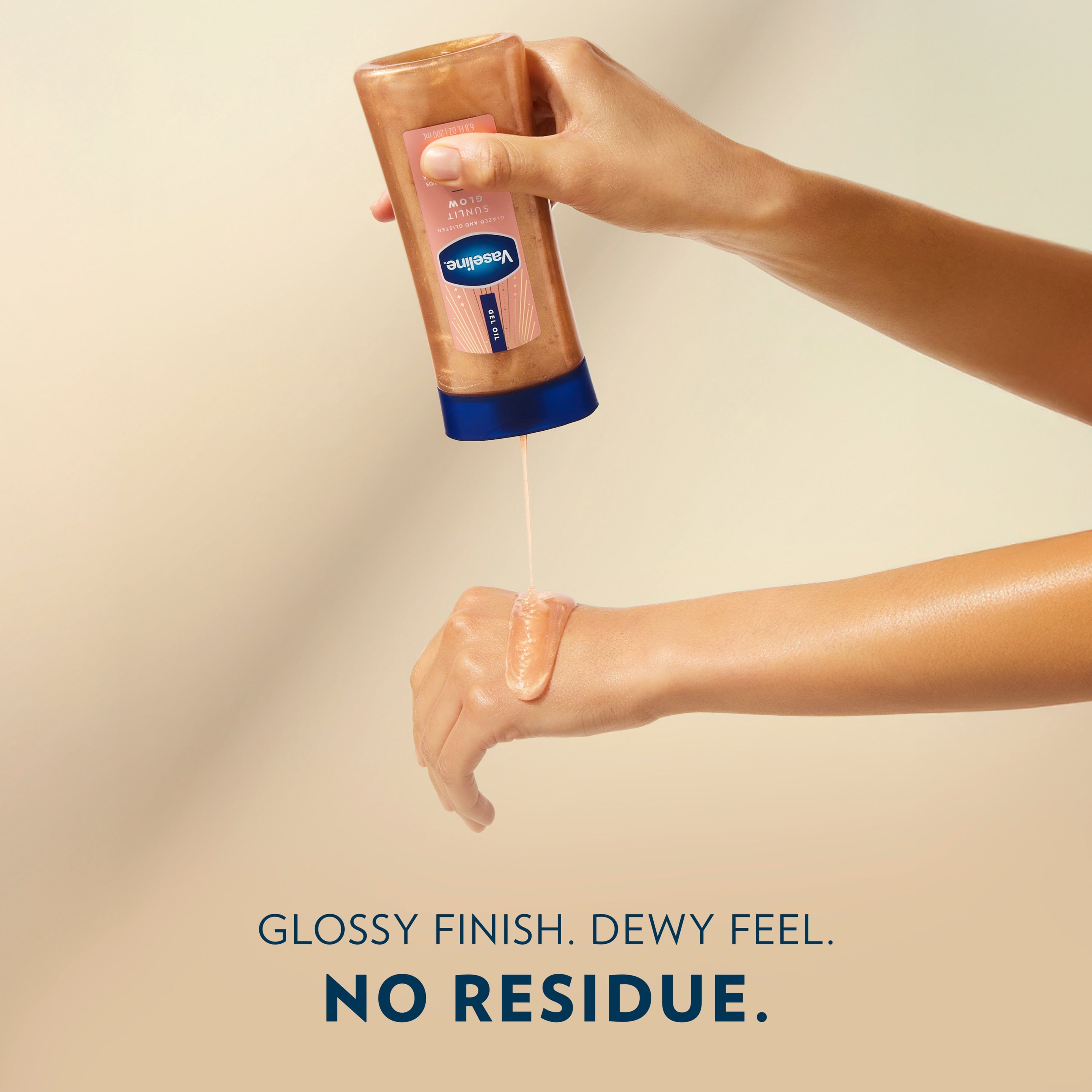 A person pours Vaseline Sunlit Glow gel oil onto the back of a hand above text