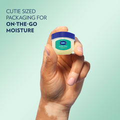 A hand holds a jar of Vaseline® Lip Therapy® Arctic Mint Mini next to text